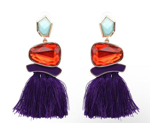 Pendientes statement con borla violeta